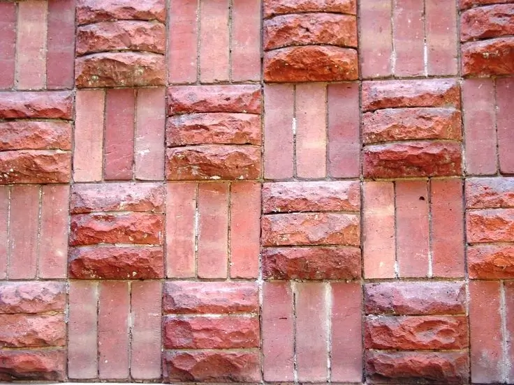 A pallet of red masonry bricks