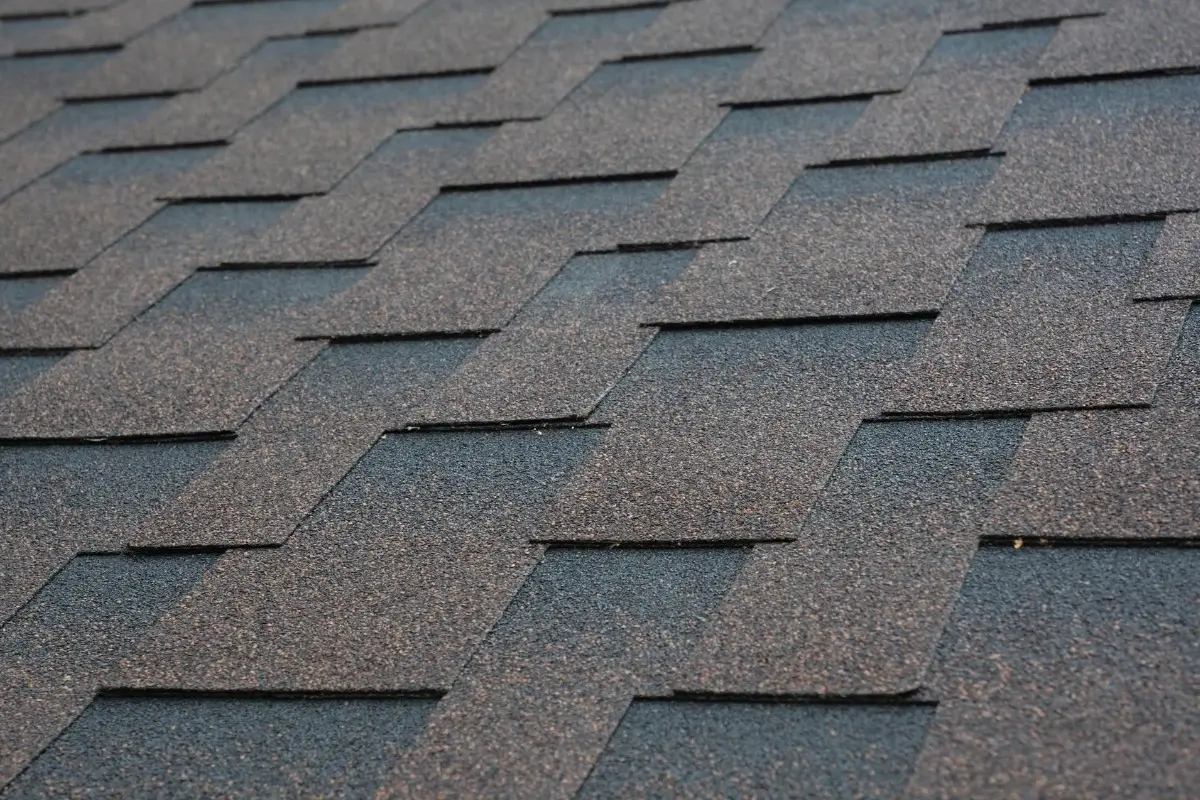 Bundles of architectural asphalt roofing shingles