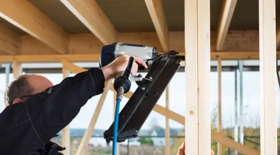 A pneumatic framing nail gun