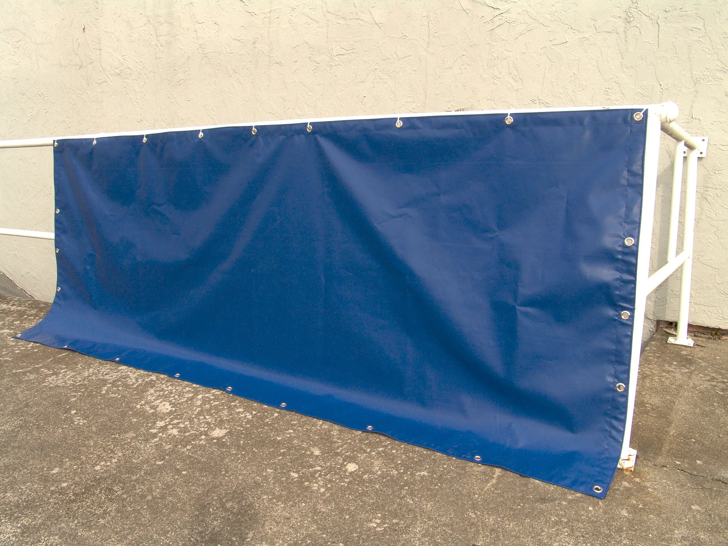 A folded blue heavy-duty tarp